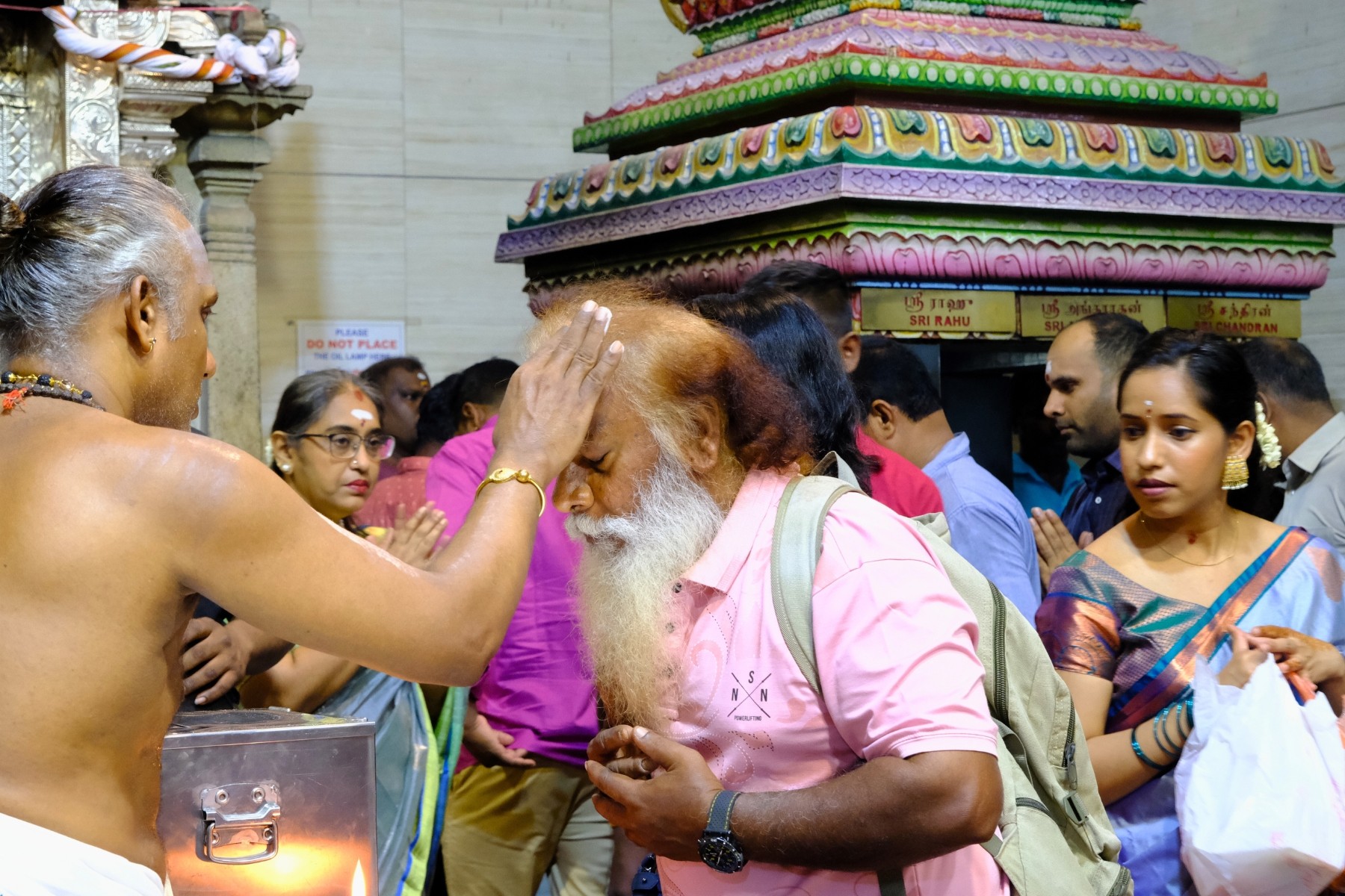 Hindu devotees performing traditional Deepavali rituals in Singapore