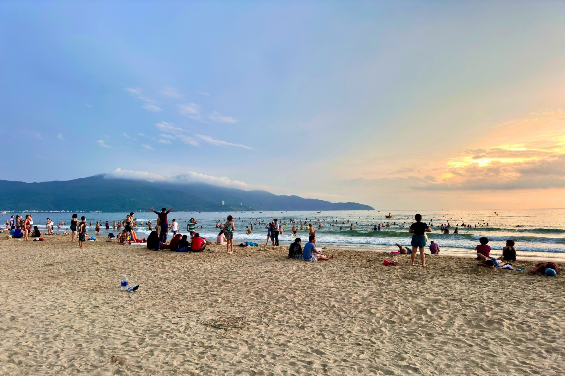 Families enjoy sunrise at My Khe Beach in Da Nang