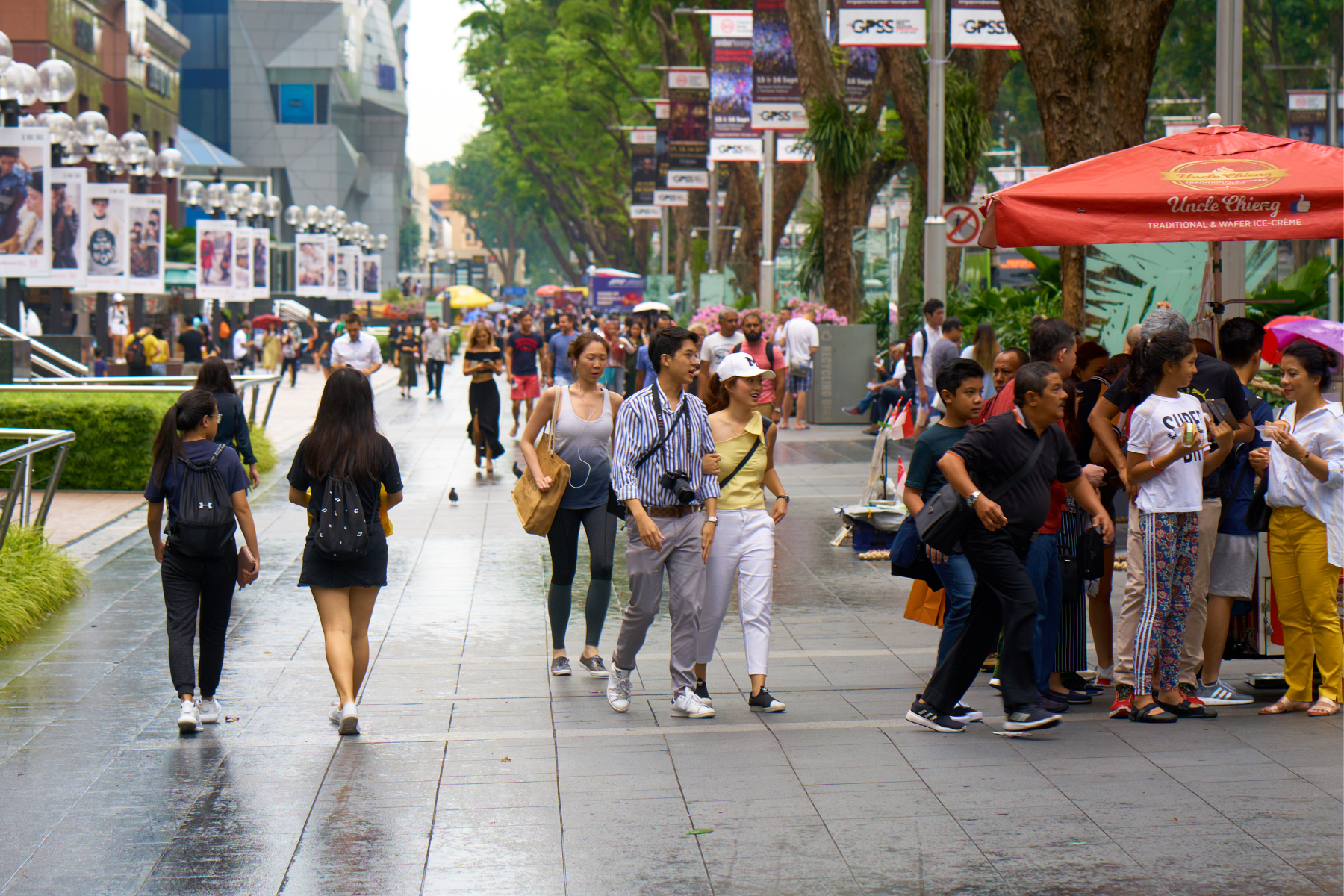 Locals and tourists on the lively streets of Singapore in September