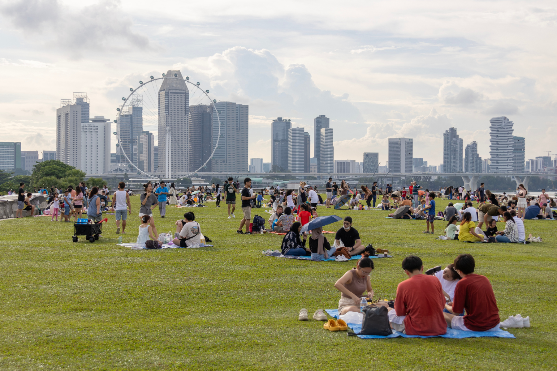  Recreation area in Marina Barrage, a dam in Singapore with city view where people, including coup are social gathering